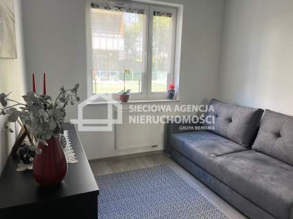 Apartament z tarasem i miejscem parkingowym.